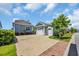 House exterior featuring a driveway, a two car garage and beautiful landscaping at 8185 Sandlapper Way, Myrtle Beach, SC 29572