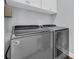Modern laundry room with front-loading washer and dryer, offering convenience and efficiency for chores at 8185 Sandlapper Way, Myrtle Beach, SC 29572