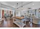 Open floor plan featuring living area, kitchen and dining room with hardwood floors and modern finishes at 8185 Sandlapper Way, Myrtle Beach, SC 29572