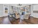 Cozy living room with a fireplace, hardwood floors, and natural lighting at 8185 Sandlapper Way, Myrtle Beach, SC 29572