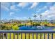 Picturesque pond view showcasing community homes and landscaping with a fountain in the distance at 8185 Sandlapper Way, Myrtle Beach, SC 29572