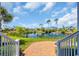 Scenic view of a tranquil pond with a fountain, lush greenery, and neighborhood homes at 8185 Sandlapper Way, Myrtle Beach, SC 29572