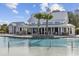 Beautiful pool area with palm trees, resort-style seating, and a covered pavilion at 8185 Sandlapper Way, Myrtle Beach, SC 29572