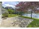 Lush backyard with a scenic pond, complemented by mature trees and a tranquil fountain feature at 8204 Caddis Ct., Myrtle Beach, SC 29579