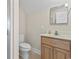 Bright bathroom featuring a vanity with wood cabinet and toilet with ceramic tile flooring at 8204 Caddis Ct., Myrtle Beach, SC 29579
