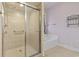 Well-appointed bathroom features a tiled shower, garden tub, and natural light at 8204 Caddis Ct., Myrtle Beach, SC 29579