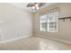 Well-lit bedroom featuring neutral walls, tiled flooring, and a window with natural light at 8204 Caddis Ct., Myrtle Beach, SC 29579