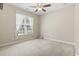 Cozy bedroom featuring a ceiling fan, carpet, and window letting in natural light at 8204 Caddis Ct., Myrtle Beach, SC 29579