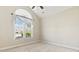Bright bedroom featuring a vaulted ceiling, window, and carpeted flooring at 8204 Caddis Ct., Myrtle Beach, SC 29579