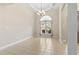 An empty dining room featuring neutral walls, chandelier lighting, and ample natural light from the window at 8204 Caddis Ct., Myrtle Beach, SC 29579