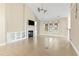 Bright living room with vaulted ceilings, fireplace, built-in shelving, and a view of the backyard at 8204 Caddis Ct., Myrtle Beach, SC 29579