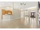 Open-concept living space with tile flooring, neutral paint, and a seamless flow into the kitchen and entry at 8204 Caddis Ct., Myrtle Beach, SC 29579