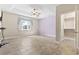 Spacious main bedroom boasts a tray ceiling, ceiling fan, and tiled floors, with a walk-in closet for ample storage at 8204 Caddis Ct., Myrtle Beach, SC 29579