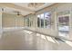 Light-filled sunroom featuring large windows with views of the lake and surrounding scenery at 8204 Caddis Ct., Myrtle Beach, SC 29579