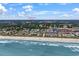 Stunning coastal aerial view with beach, residential homes, and amenities like a golf course and shopping at 843 Villa Dr. # 843, North Myrtle Beach, SC 29582