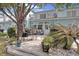 Backyard features a deck with a grill, seating, and lush greenery at 843 Villa Dr. # 843, North Myrtle Beach, SC 29582