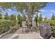 The patio is a serene escape surrounded by lush greenery, and outfitted with a grill and seating at 843 Villa Dr. # 843, North Myrtle Beach, SC 29582