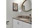 Bathroom with decorative mirror, art and granite countertops at 843 Villa Dr. # 843, North Myrtle Beach, SC 29582