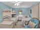Bright bedroom with bunkbeds, a single bed, and coastal decor creates a serene sleeping space at 843 Villa Dr. # 843, North Myrtle Beach, SC 29582