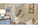 Hallway with stairs leading to bedrooms, decorated with pictures and nautical decor at 843 Villa Dr. # 843, North Myrtle Beach, SC 29582