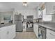Kitchen view with white cabinets, stainless steel appliances and decor at 843 Villa Dr. # 843, North Myrtle Beach, SC 29582