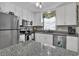 Kitchen view with white cabinetry, stainless steel appliances and granite countertops at 843 Villa Dr. # 843, North Myrtle Beach, SC 29582
