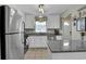 Kitchen view with white cabinetry, stainless steel appliances and granite countertops at 843 Villa Dr. # 843, North Myrtle Beach, SC 29582