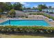 Community pool surrounded by lounge chairs for relaxation, with well maintained landscaping for summer fun at 843 Villa Dr. # 843, North Myrtle Beach, SC 29582