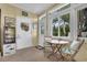 Cozy sunroom with large windows, offers a comfortable space to enjoy the natural light at 843 Villa Dr. # 843, North Myrtle Beach, SC 29582