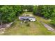 Aerial view of property showcasing home, outbuildings, and vast acreage at 856 W Highway 9, Longs, SC 29568