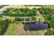 Expansive aerial view highlighting a scenic lake, lush trees, and the surrounding countryside at 856 W Highway 9, Longs, SC 29568