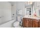 Bathroom with a tub, single vanity, and tiled floors at 856 W Highway 9, Longs, SC 29568