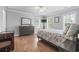Bedroom with neutral walls, hardwood floors, and two large windows at 856 W Highway 9, Longs, SC 29568