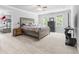 Spacious bedroom with ensuite bath, ceiling fan, dresser, and television at 856 W Highway 9, Longs, SC 29568