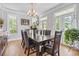 Formal dining room featuring hardwood floors, chandelier lighting and large dining table at 856 W Highway 9, Longs, SC 29568