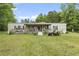 Charming home with a covered front porch, well-maintained lawn, and mature trees at 856 W Highway 9, Longs, SC 29568