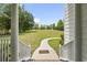 View from porch to large lawn with a winding walkway leading to this home at 856 W Highway 9, Longs, SC 29568