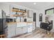 Charming kitchen with white cabinetry, wood countertops, open shelves, and stylish fixtures at 856 W Highway 9, Longs, SC 29568