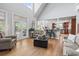 Inviting living room with high ceilings, hardwood floors, and an open flow to the kitchen at 856 W Highway 9, Longs, SC 29568