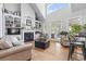 Spacious living room boasting custom built-ins, a cozy fireplace and large bright windows at 856 W Highway 9, Longs, SC 29568