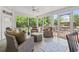 Bright sunroom featuring tile flooring, lots of windows, and comfortable seating at 856 W Highway 9, Longs, SC 29568