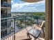 Balcony with seating, offering a view of lush green neighborhood and bright blue sky at 8560 Queensway Blvd. # 1109, Myrtle Beach, SC 29572