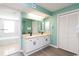Bathroom boasts dual sinks, neutral countertops, light cabinetry, and a tub/shower combo at 8560 Queensway Blvd. # 1109, Myrtle Beach, SC 29572