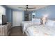 Bright bedroom featuring two beds, seaside decor, wood floors, large closet and dresser at 8560 Queensway Blvd. # 1109, Myrtle Beach, SC 29572