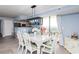 Dining area with modern light fixture, bar seating, and balcony access at 8560 Queensway Blvd. # 1109, Myrtle Beach, SC 29572