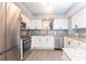 Kitchen featuring stainless appliances, granite countertops, white cabinets, and modern finishes at 8560 Queensway Blvd. # 1109, Myrtle Beach, SC 29572