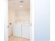 Laundry room contains a washer, dryer, wire shelving, and additional storage space at 8560 Queensway Blvd. # 1109, Myrtle Beach, SC 29572