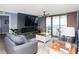 Living room featuring ocean views, an electric fireplace, plush seating, and balcony access at 8560 Queensway Blvd. # 1109, Myrtle Beach, SC 29572