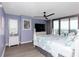 Bedroom featuring a flat-screen TV, dresser, and sliding glass door access to the balcony with ocean view at 8560 Queensway Blvd. # 1109, Myrtle Beach, SC 29572