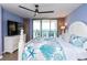 Bedroom featuring a coastal-themed bedspread and access to balcony with ocean views at 8560 Queensway Blvd. # 1109, Myrtle Beach, SC 29572